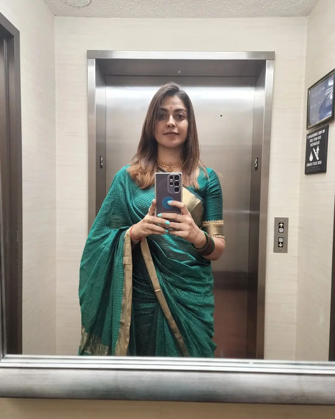 Anusree Nair Wearing Beautiful Earrings Jewellery Green Saree Blouse